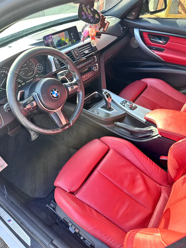 Clean black leather rear seats after interior detailing